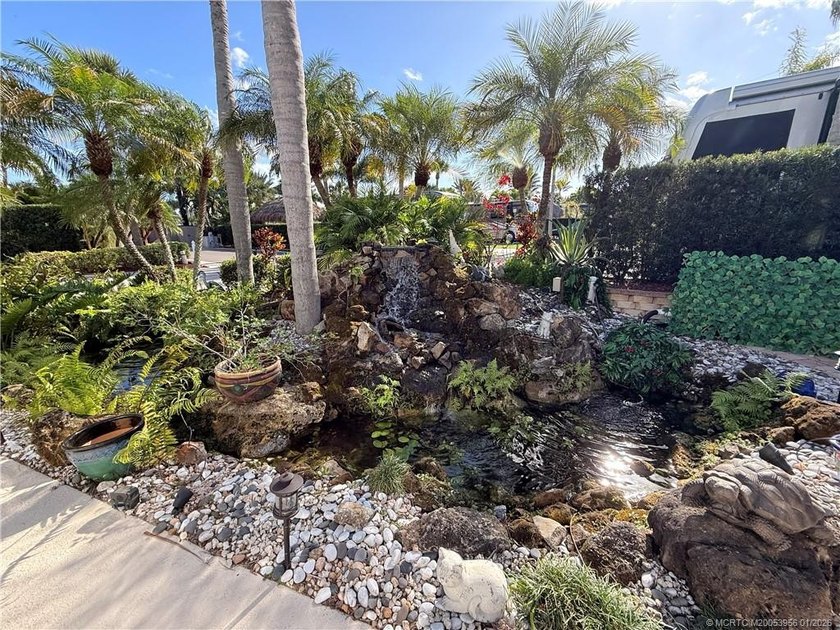 Located on the large lake with double fountains, this is truly - photo 6