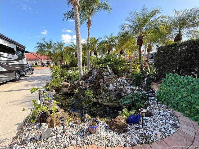Located on the large lake with double fountains, this is truly - photo 7
