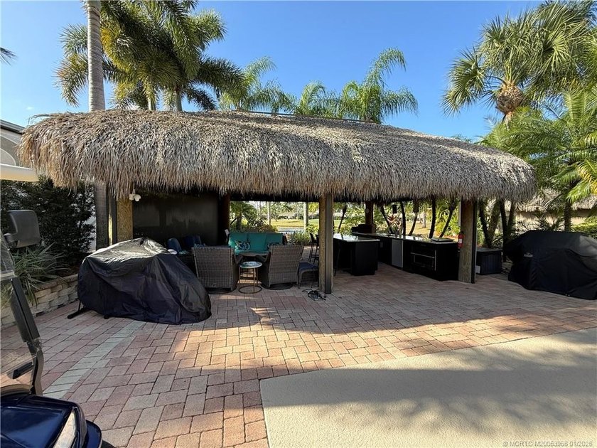 Located on the large lake with double fountains, this is truly - photo 9