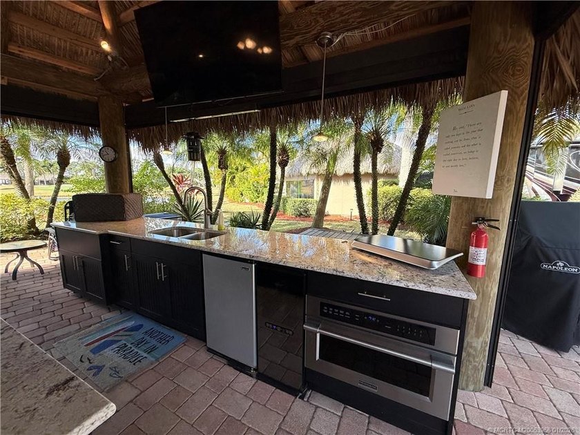 Located on the large lake with double fountains, this is truly - photo 10