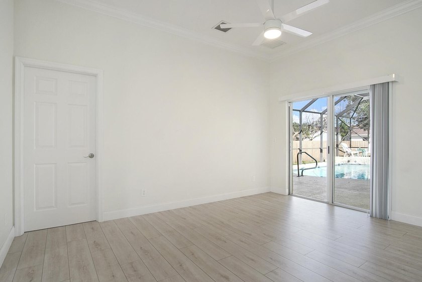 This stunning pool home has it all! Gorgeous plank tile flooring - photo 12