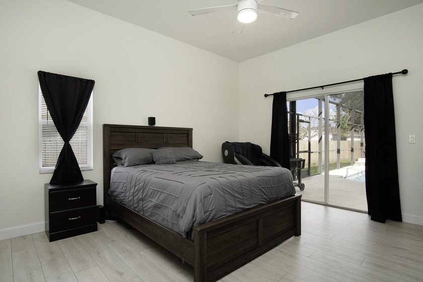 This stunning pool home has it all! Gorgeous plank tile flooring - photo 13