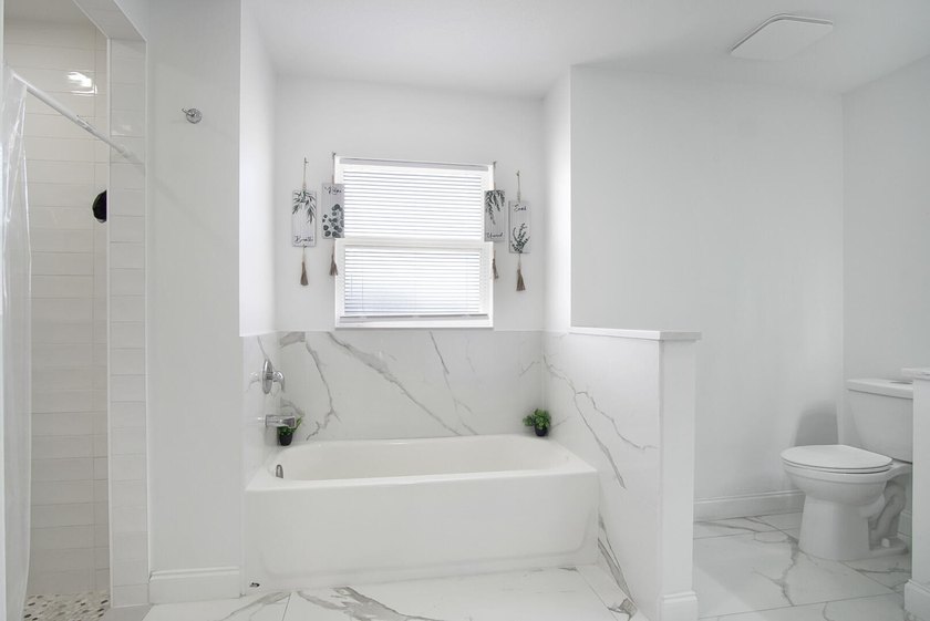 This stunning pool home has it all! Gorgeous plank tile flooring - photo 15