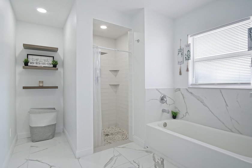 This stunning pool home has it all! Gorgeous plank tile flooring - photo 16