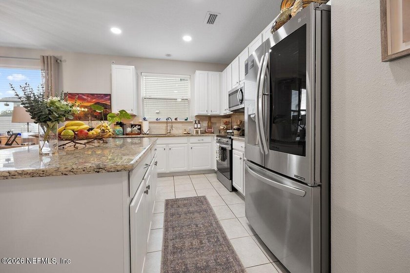 Move-in ready perfection in Bartram Park Preserve! This - photo 8