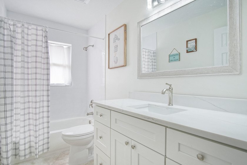 This stunning pool home has it all! Gorgeous plank tile flooring - photo 20