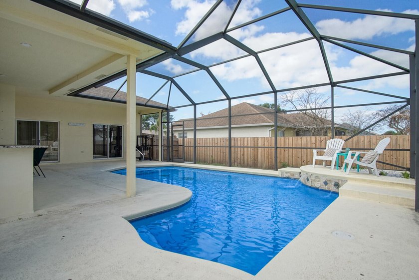 This stunning pool home has it all! Gorgeous plank tile flooring - photo 23