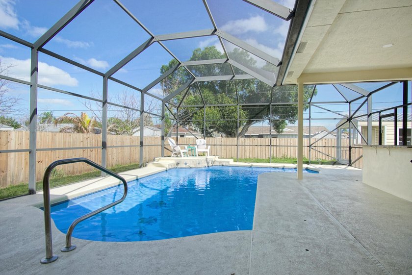 This stunning pool home has it all! Gorgeous plank tile flooring - photo 24