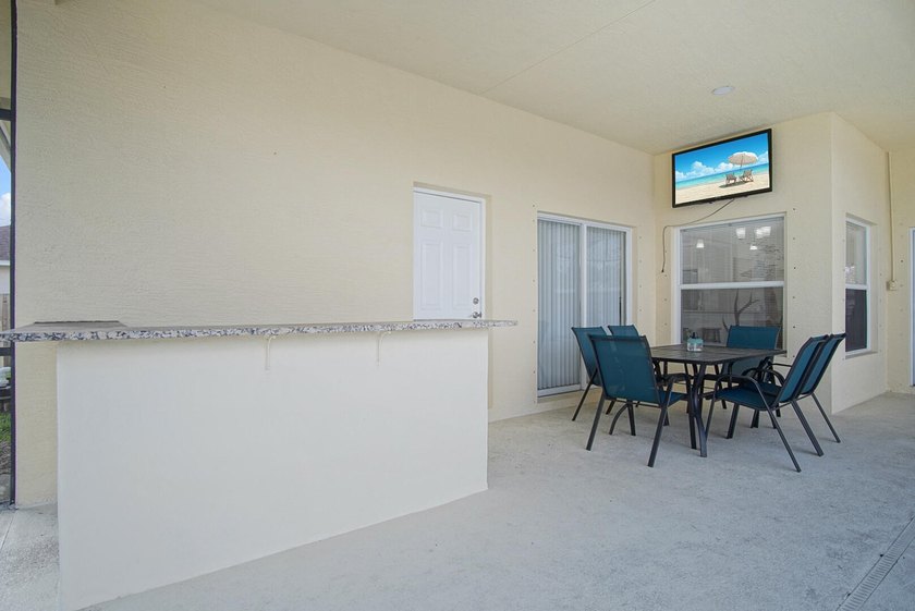 This stunning pool home has it all! Gorgeous plank tile flooring - photo 26