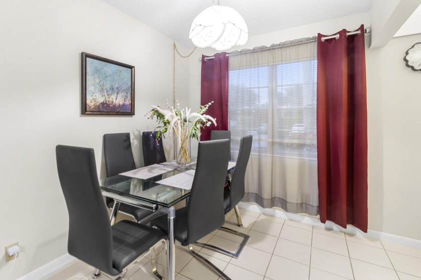 Welcome to this inviting 2-bedroom, 1.5-bathroom condominium - photo 2