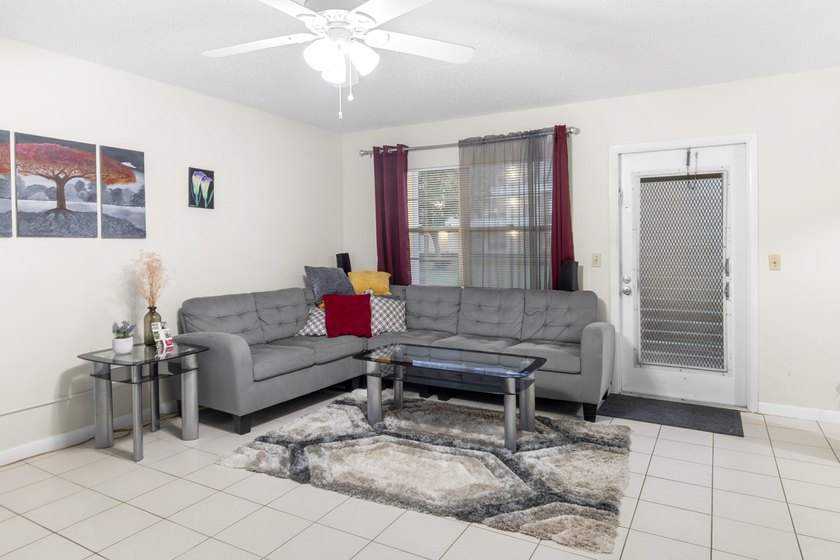 Welcome to this inviting 2-bedroom, 1.5-bathroom condominium - photo 3