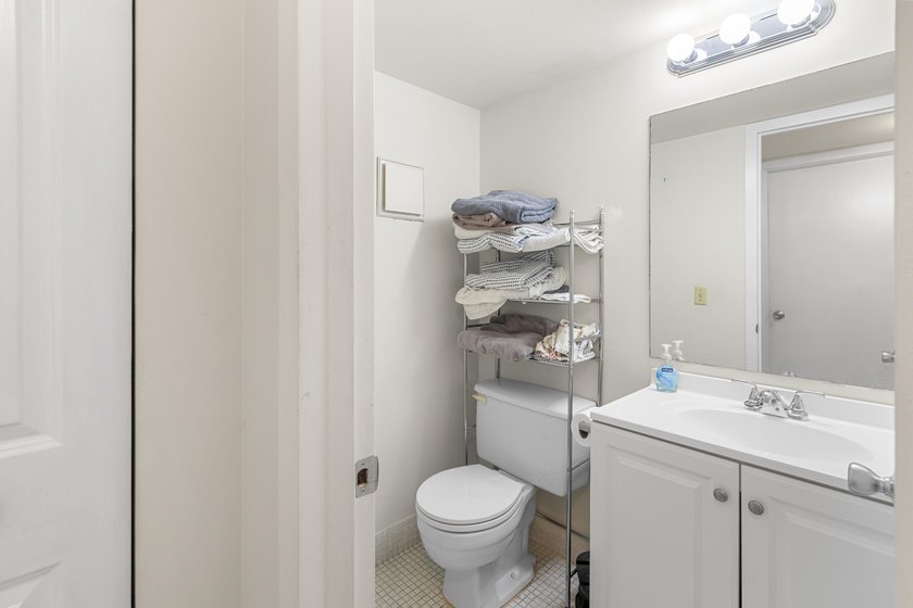 Welcome to this inviting 2-bedroom, 1.5-bathroom condominium - photo 6