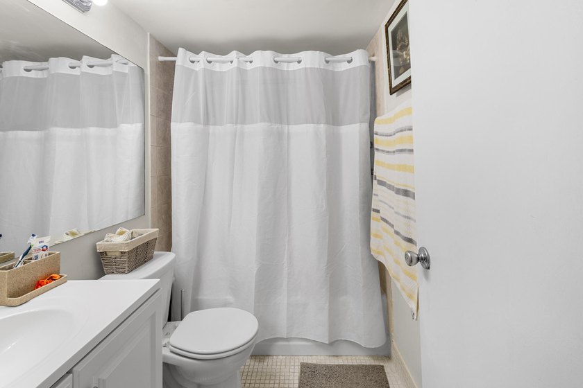 Welcome to this inviting 2-bedroom, 1.5-bathroom condominium - photo 7