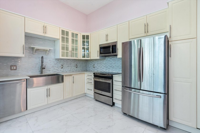 This beautifully renovated 2-bedroom, 2.5-bath townhome offers a - photo 7