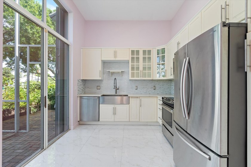 This beautifully renovated 2-bedroom, 2.5-bath townhome offers a - photo 8