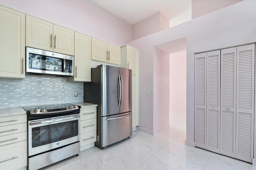 This beautifully renovated 2-bedroom, 2.5-bath townhome offers a - photo 9