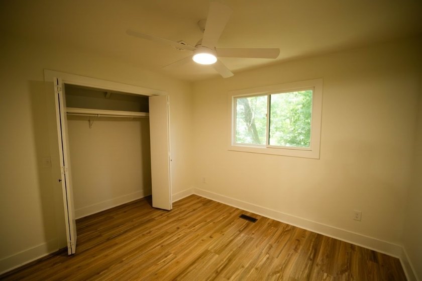 Totally remodeled - new roof, flooring, paint, appliances - photo 19