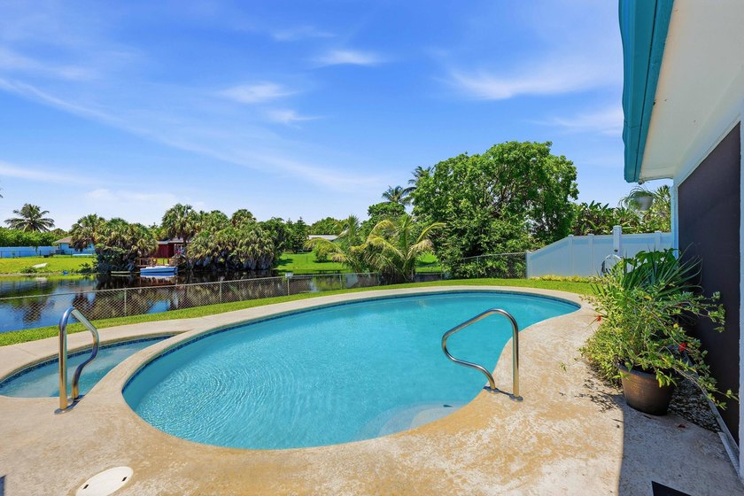 This well-maintained 3-bed, 2-bath CBS pool home sits on one of - photo 31