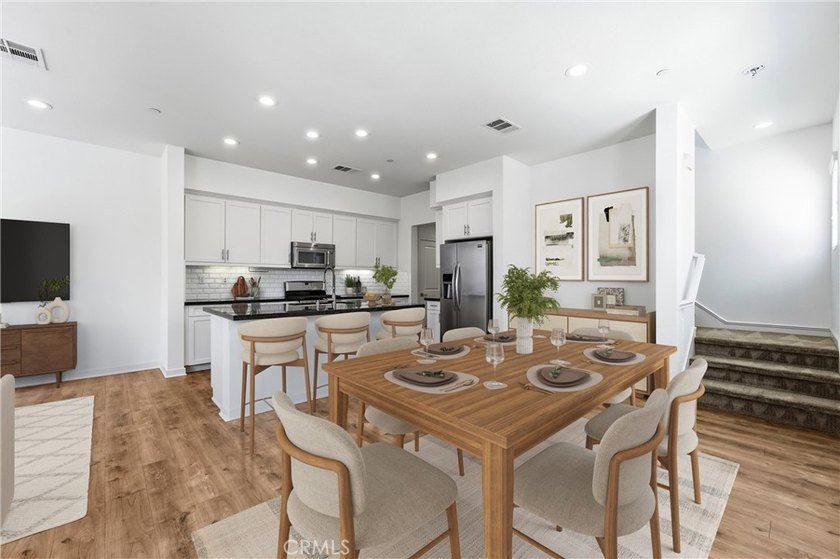 Welcome to this beautifully upgraded end unit townhome located - photo 3