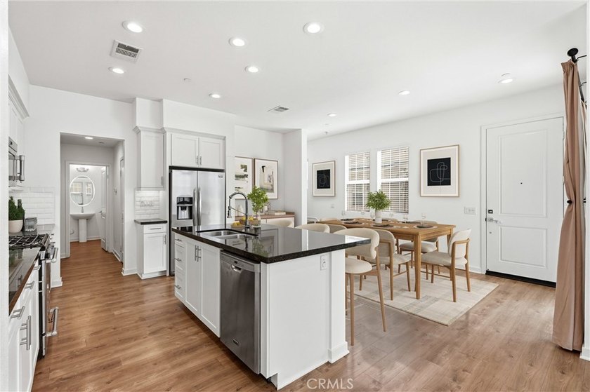Welcome to this beautifully upgraded end unit townhome located - photo 5