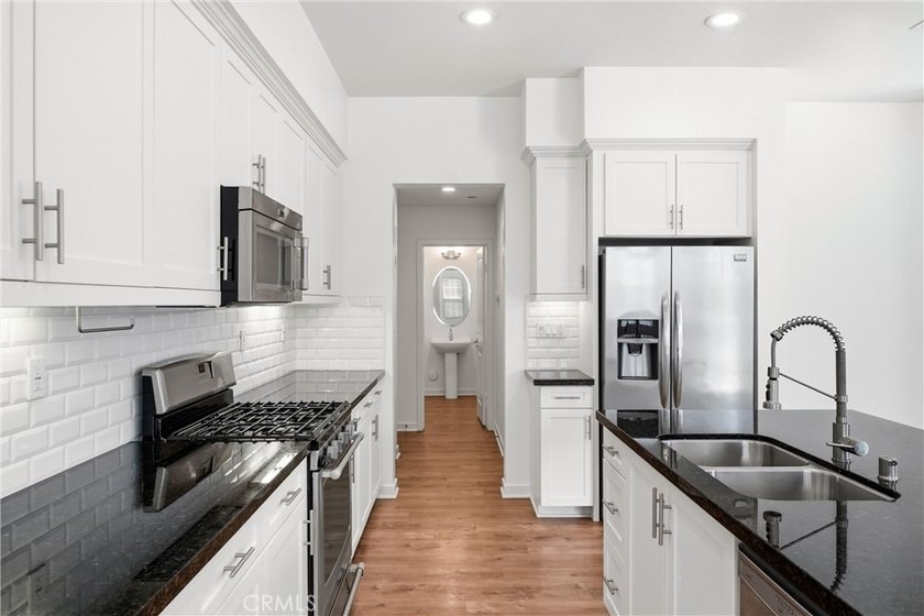 Welcome to this beautifully upgraded end unit townhome located - photo 8