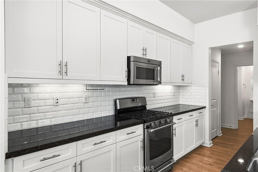 Welcome to this beautifully upgraded end unit townhome located - photo 9
