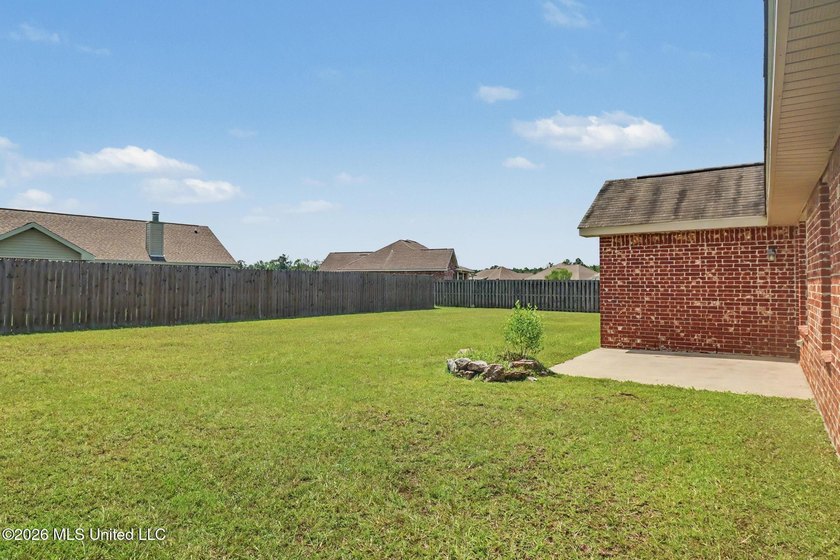 New to the market! This inviting 3-bedroom, 2-bath home offers a - photo 2