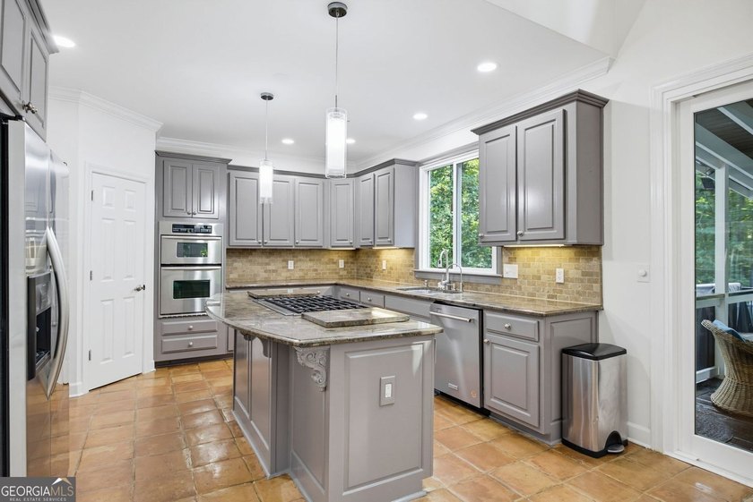 Tucked away on a beautifully landscaped lot of over 1 acre, this - photo 11
