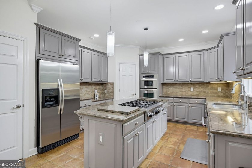 Tucked away on a beautifully landscaped lot of over 1 acre, this - photo 12