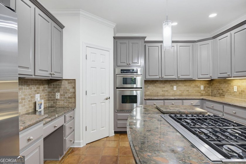 Tucked away on a beautifully landscaped lot of over 1 acre, this - photo 13