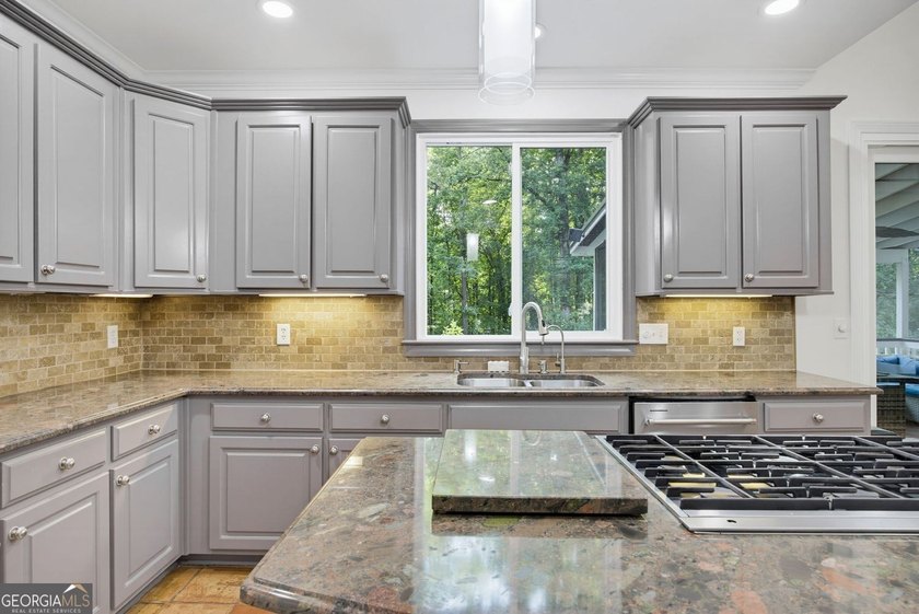 Tucked away on a beautifully landscaped lot of over 1 acre, this - photo 14