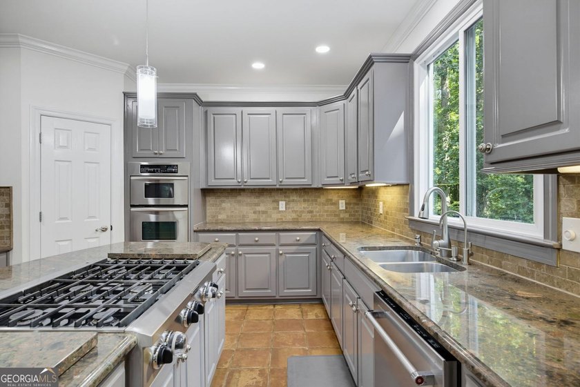 Tucked away on a beautifully landscaped lot of over 1 acre, this - photo 16