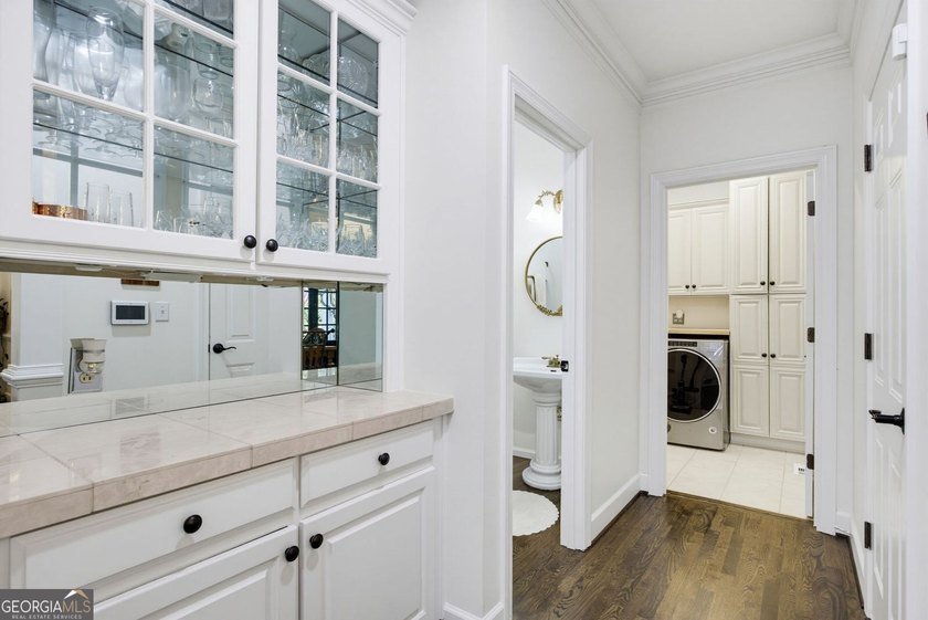 Tucked away on a beautifully landscaped lot of over 1 acre, this - photo 26
