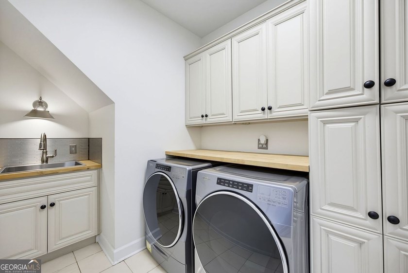Tucked away on a beautifully landscaped lot of over 1 acre, this - photo 28