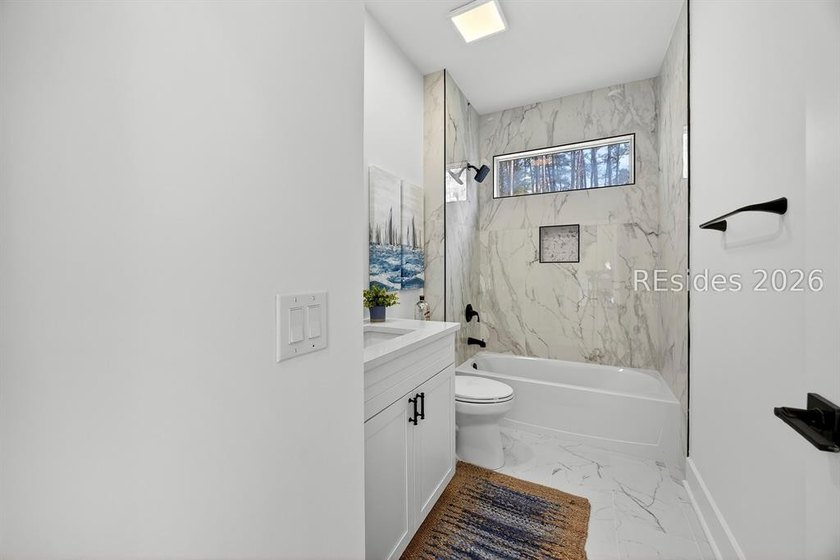 THOUGHTFULLY RENOVATED home in a prime location of the highly - photo 29