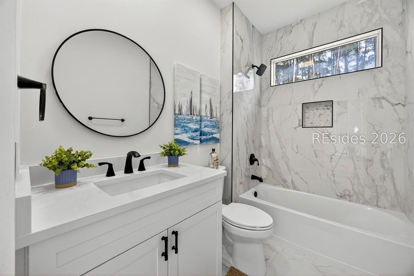 THOUGHTFULLY RENOVATED home in a prime location of the highly - photo 30