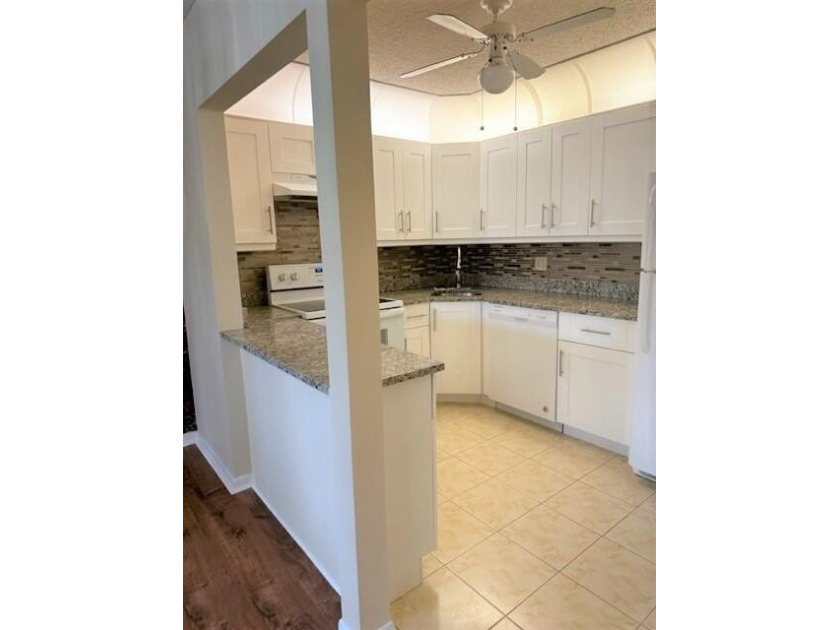 Welcome to this charming 55+ two-story condo located on the - photo 11