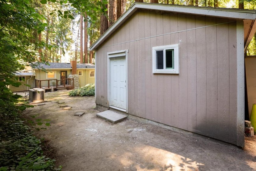 Nestled beneath a canopy of majestic redwood trees on a spacious - photo 36