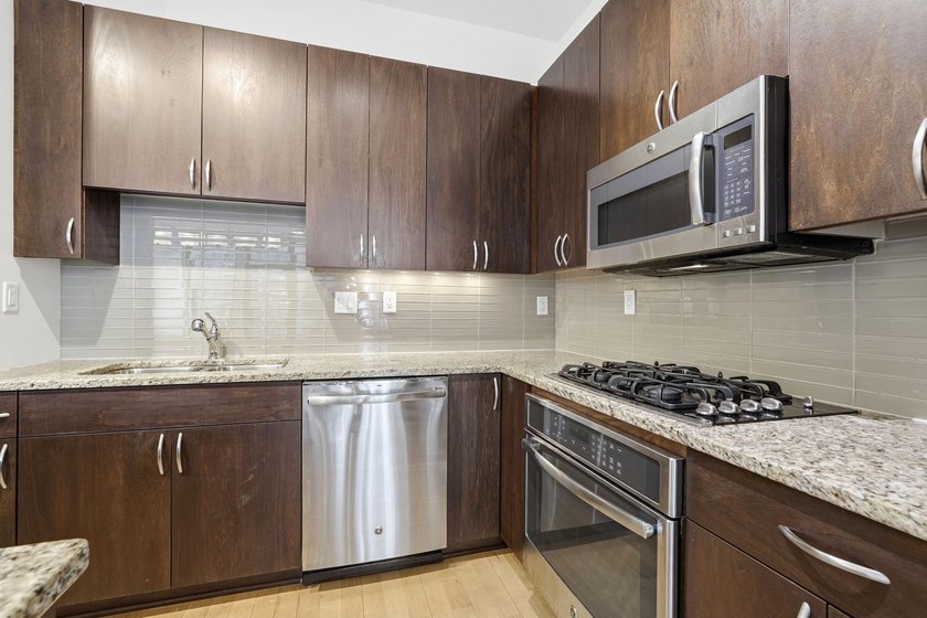 Modern Mill District Condo with a spacious floorplan flooded - photo 18