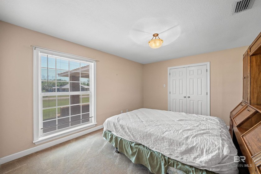 Located in a rural setting in Foley, 17635 Charolais Rd offers - photo 22