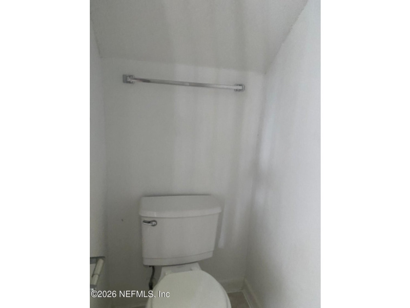 This spacious end-unit condo offers an inviting open floor plan - photo 4