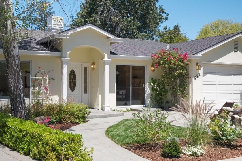 Situated on a picturesque tree-lined street and located down a - photo 2