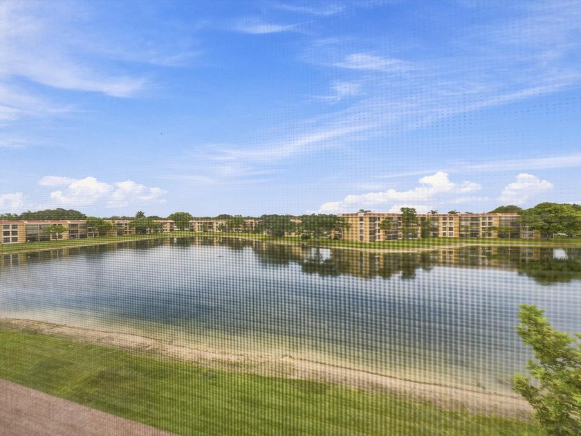 Enjoy beautiful water views and total peace of mind from this - photo 3