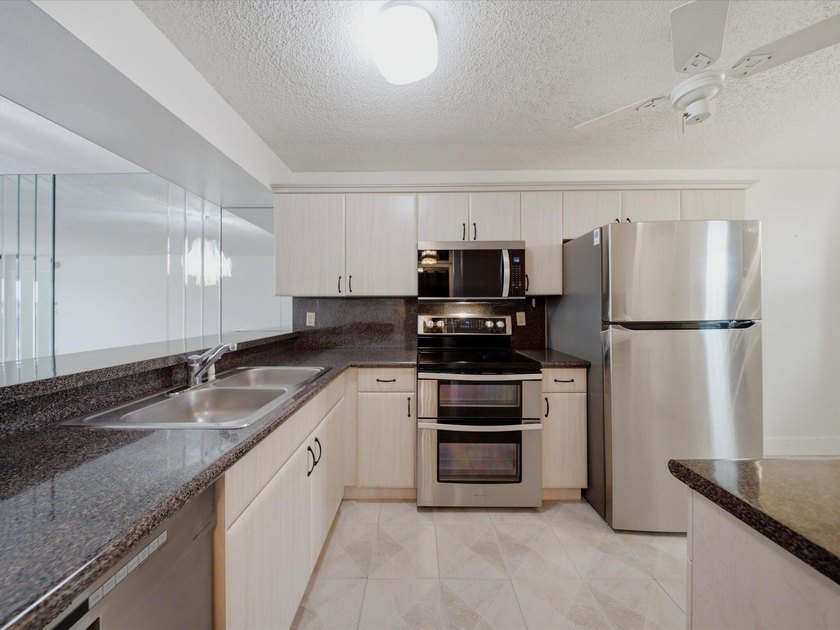 Enjoy beautiful water views and total peace of mind from this - photo 5