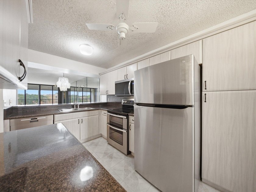 Enjoy beautiful water views and total peace of mind from this - photo 7