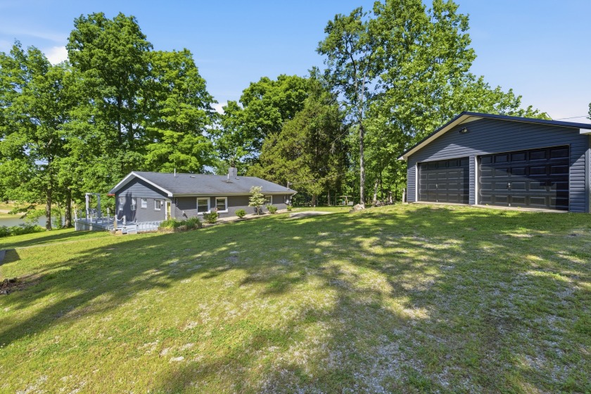 View of home and garage from street (front yard). - photo 2