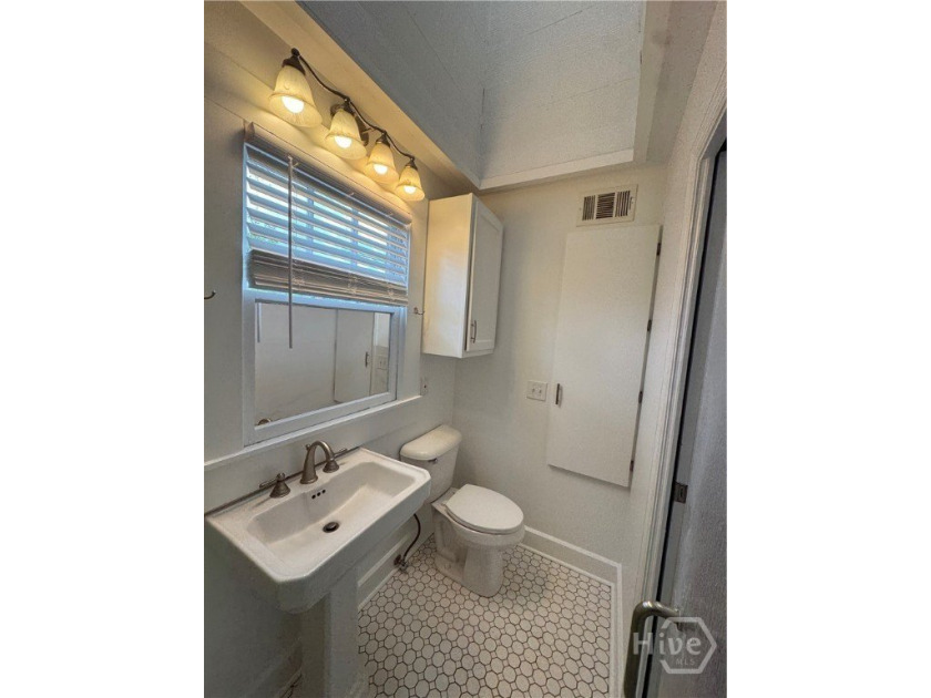 This beautifully updated 2 or 3-bedroom, 1 bathroom home is a - photo 7