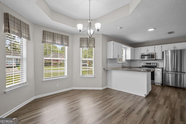 A beautifully updated 3 bedroom, 2 bath home located in the - photo 8