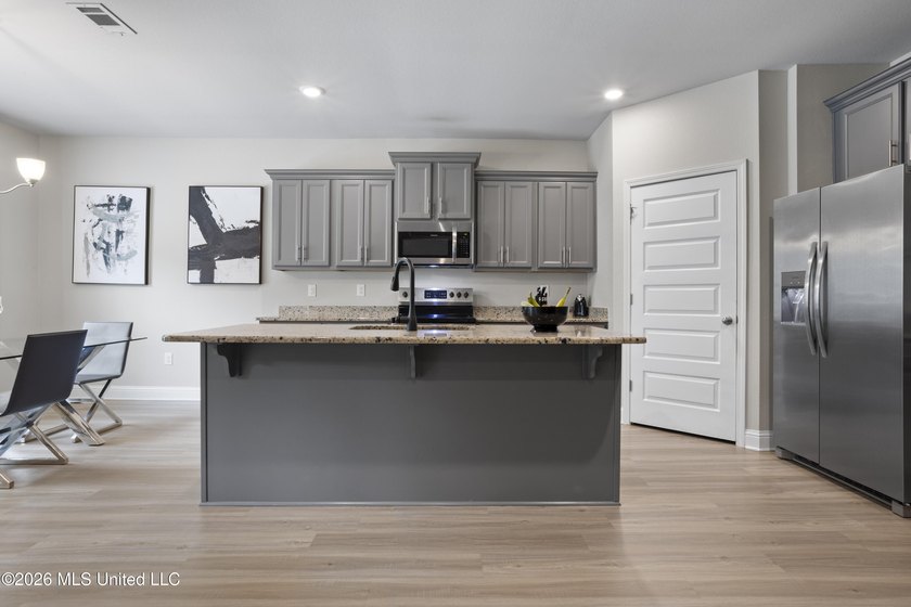 Welcome home to this beautifully maintained 4-bedroom, 3-bath - photo 10