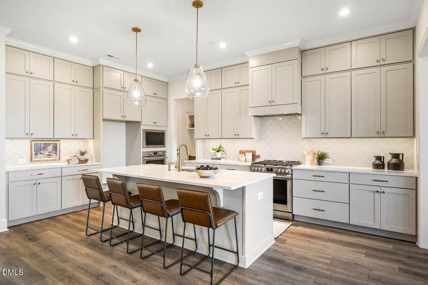 MOVE-IN READY! This beautifully designed executive townhome is - photo 2